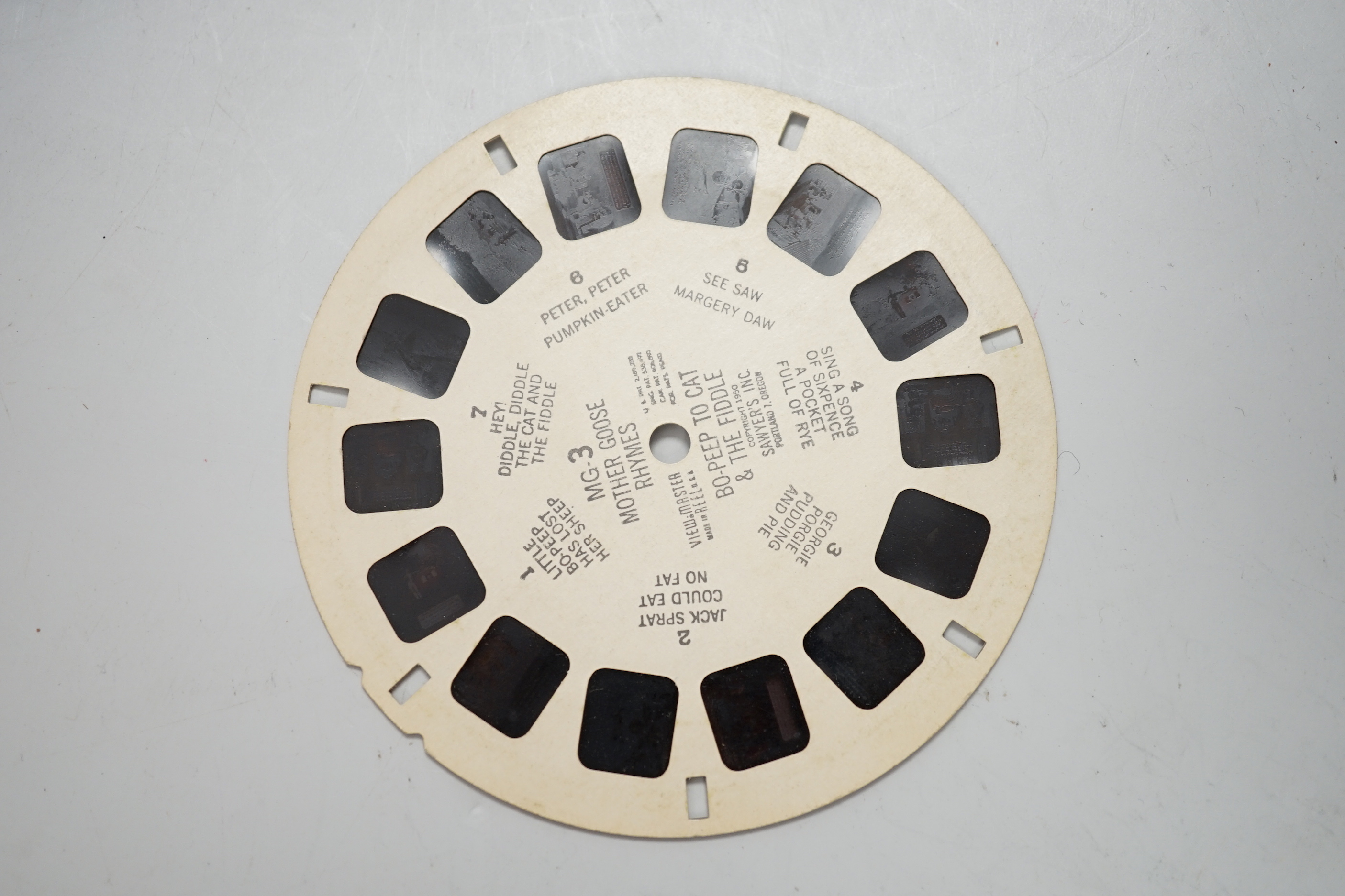 A large collection of View-Master reels contained within six plastic View-Master boxes, subjects include scenes from the United States, Charlie Brown, Bambi, Rin-Tin-Tin, etc.